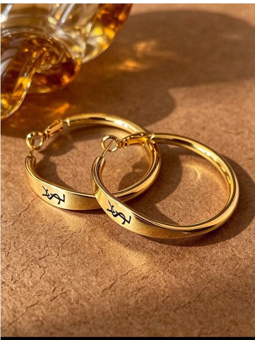 Yves Saint Laurent Gold Hoop Earrings with Black Logo Accent